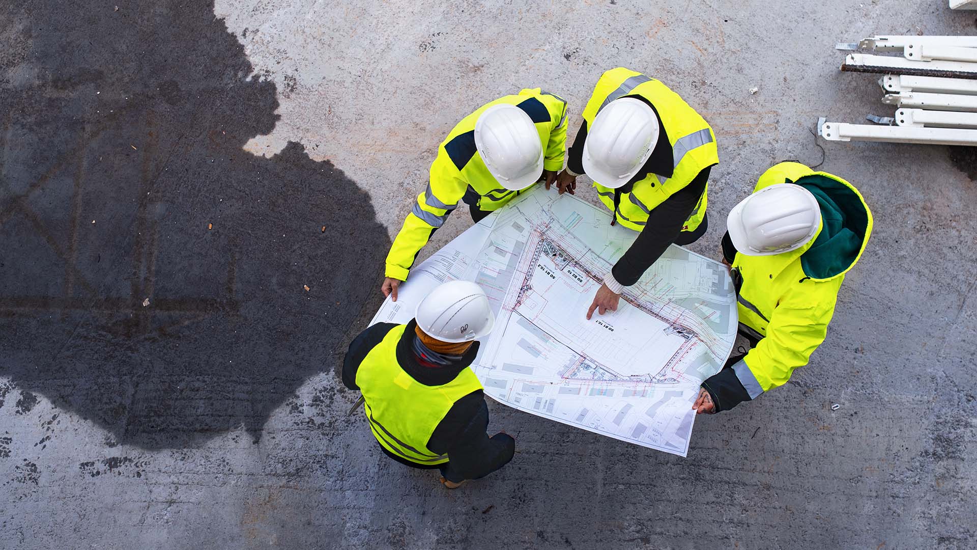 Construction_plans Construction Workers Reviewing Plans
