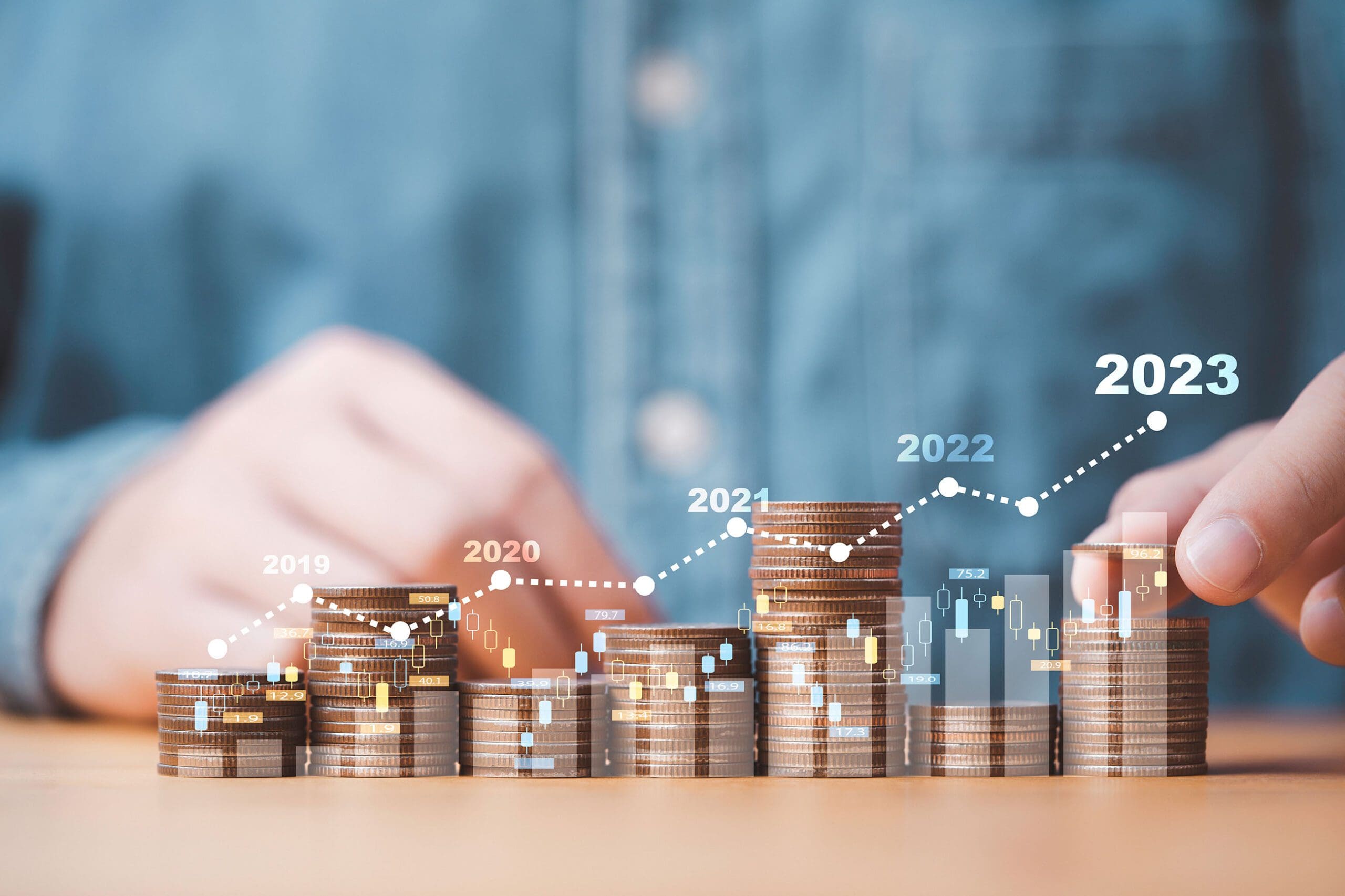 Financial outlook using coin stacks to illustrate growing profits over the years