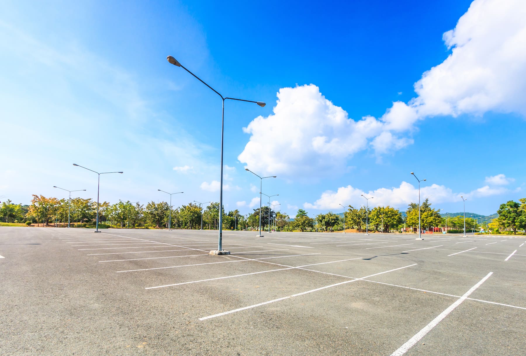 Parking Lot with Blue Sky and Clouds